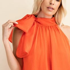 Glam NEW ARRIVALS Coral Colored Tie Front Sleeveless Blouse